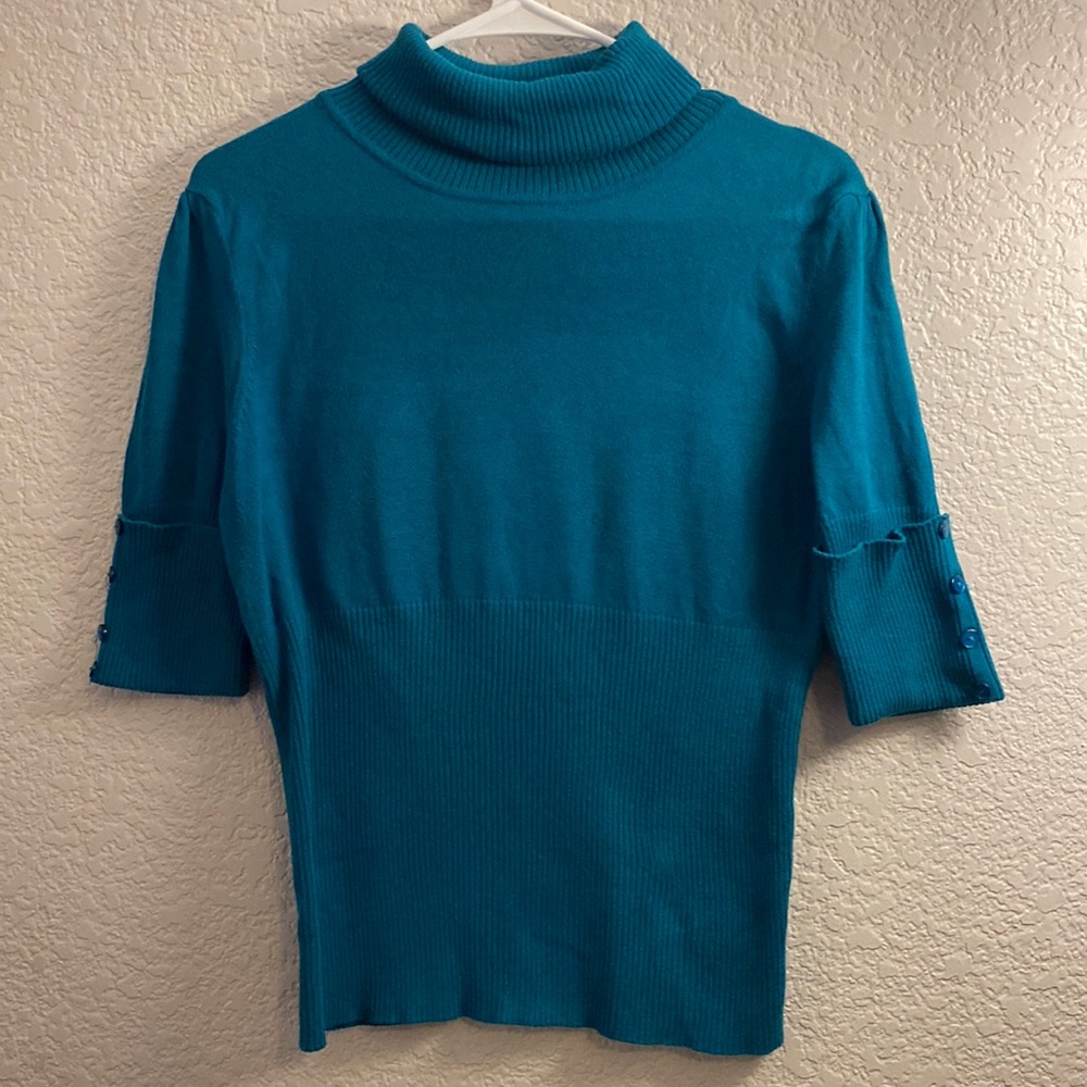 Miley Cyrus Max Azria shirt in turquoise green